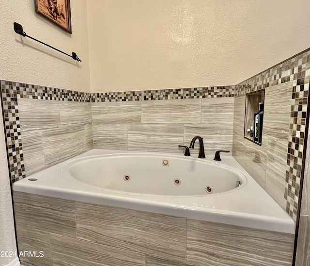 bathroom with tiled bath