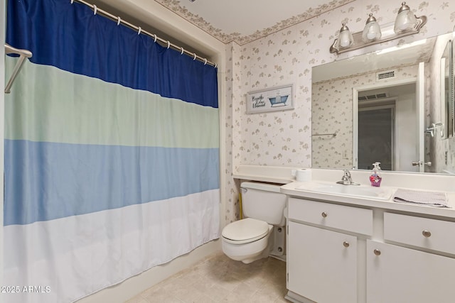 bathroom with wallpapered walls, shower / bath combination with curtain, toilet, and vanity