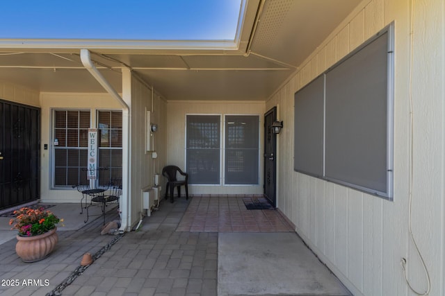 doorway to property with a patio