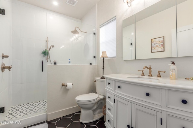 bathroom with tile patterned flooring, vanity, an enclosed shower, and toilet