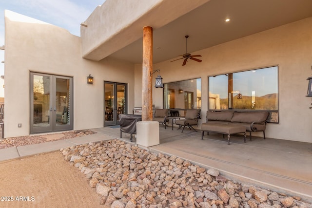 view of patio with an outdoor hangout area, ceiling fan, and french doors