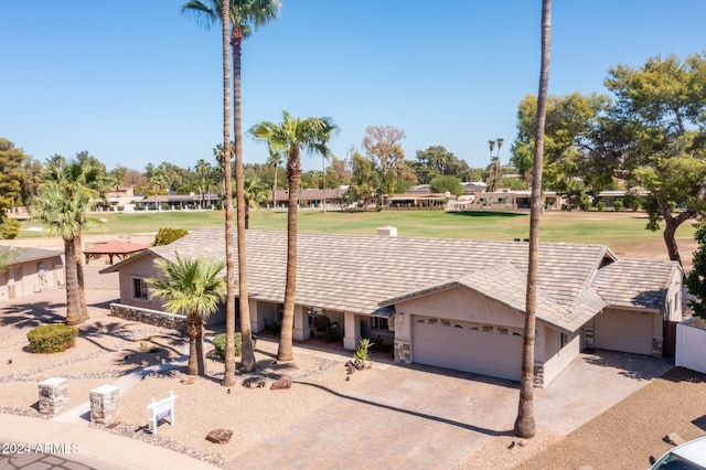 ranch-style house featuring a garage