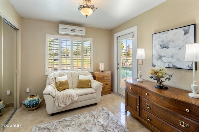 living area featuring light tile patterned floors and a wall unit AC