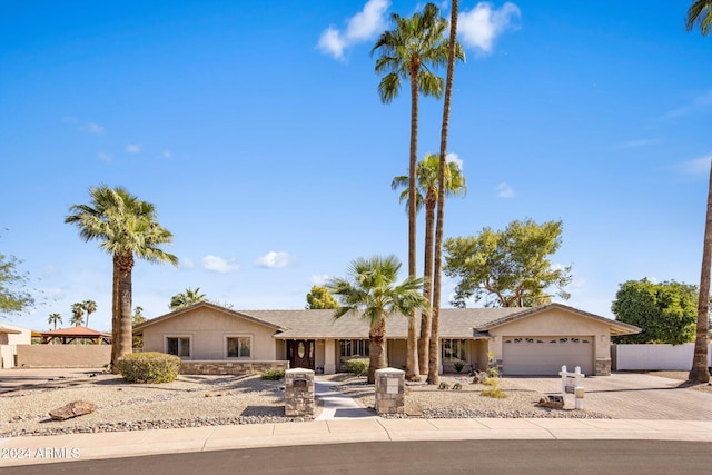 ranch-style home with a garage