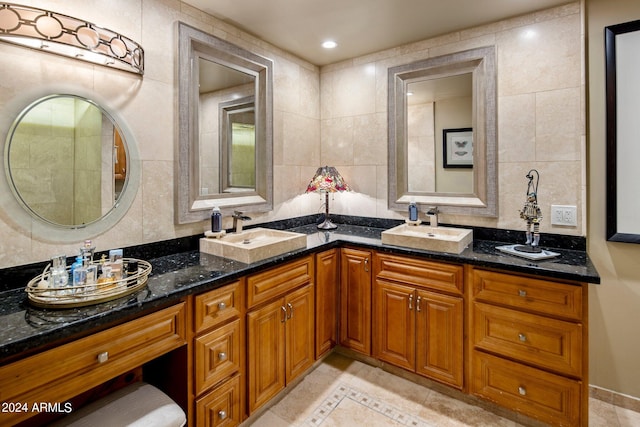 bathroom featuring vanity, tile walls, and tile patterned flooring