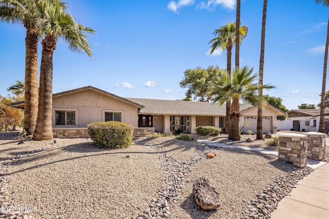 single story home featuring a garage