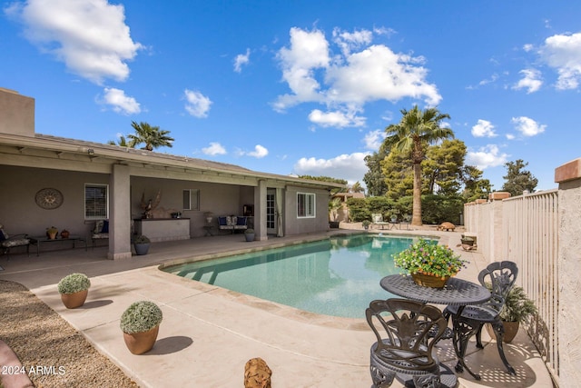 view of swimming pool featuring a patio area