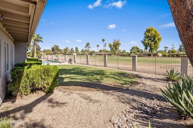 view of yard featuring a fenced in pool