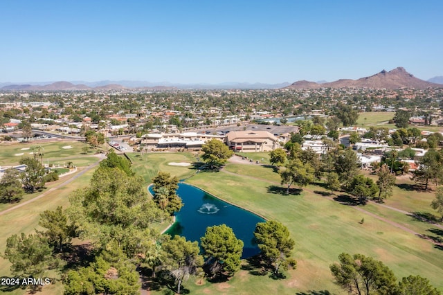 drone / aerial view with a water and mountain view