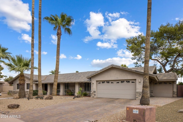 single story home featuring a garage