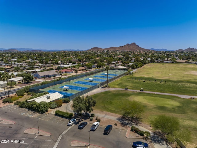 birds eye view of property with a mountain view