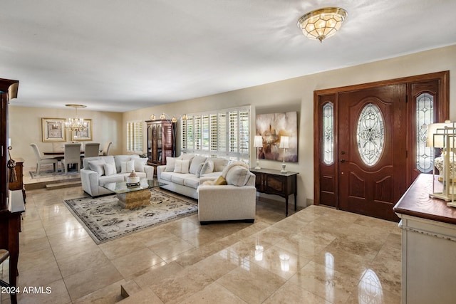 foyer featuring an inviting chandelier