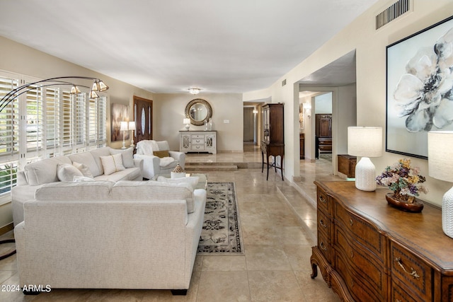 living room with an inviting chandelier