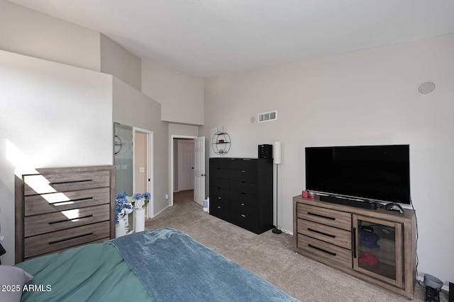 bedroom with baseboards, visible vents, vaulted ceiling, and carpet flooring