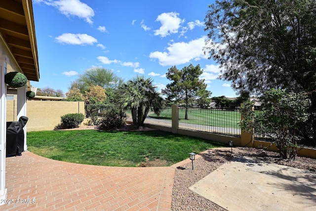 view of yard with fence private yard and a patio area