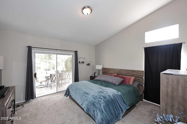 bedroom featuring access to exterior, carpet flooring, and vaulted ceiling