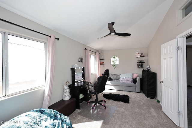 bedroom with ceiling fan, carpet, and vaulted ceiling