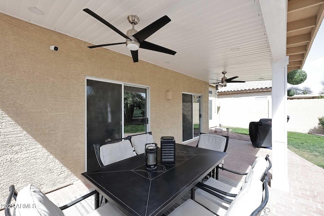 view of patio / terrace with ceiling fan and outdoor dining area