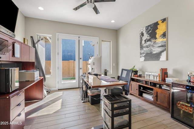 office space with wood tiled floor, recessed lighting, ceiling fan, wine cooler, and french doors