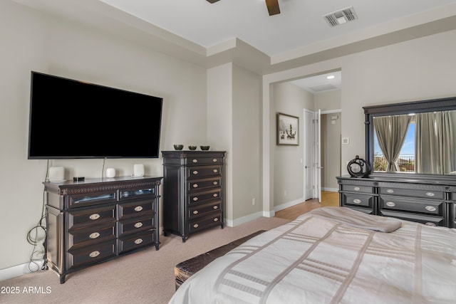 bedroom with ceiling fan, baseboards, visible vents, and light carpet