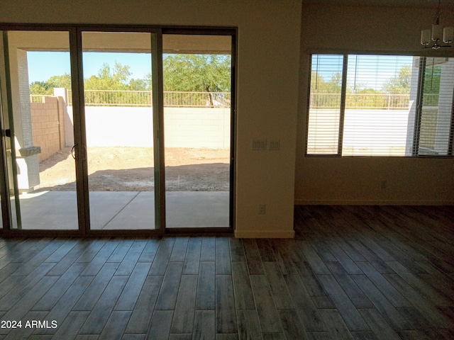 entryway featuring a notable chandelier and hardwood / wood-style flooring