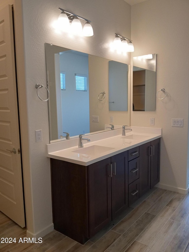 bathroom featuring vanity and wood-type flooring