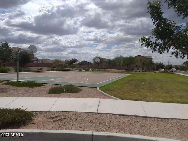 view of basketball court featuring a lawn