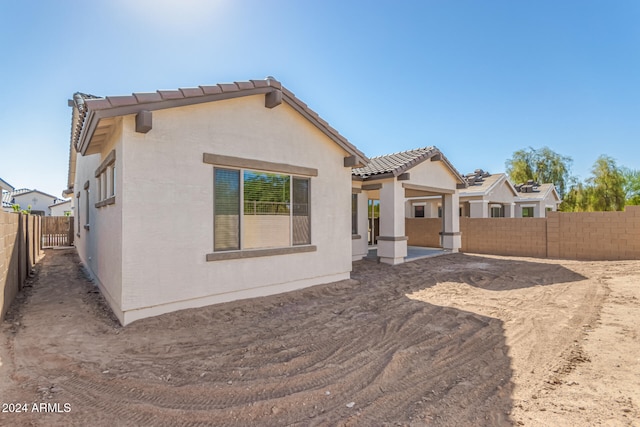 back of property with a patio area