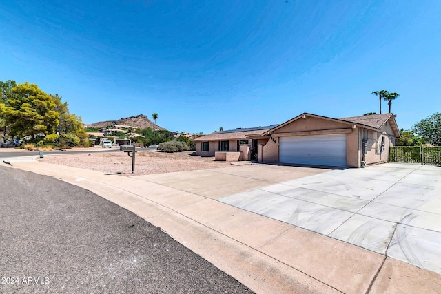 ranch-style home featuring a garage