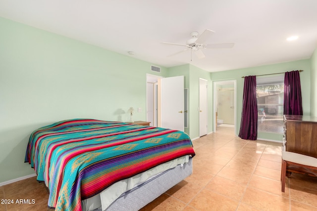 bedroom with connected bathroom, ceiling fan, and light tile patterned flooring