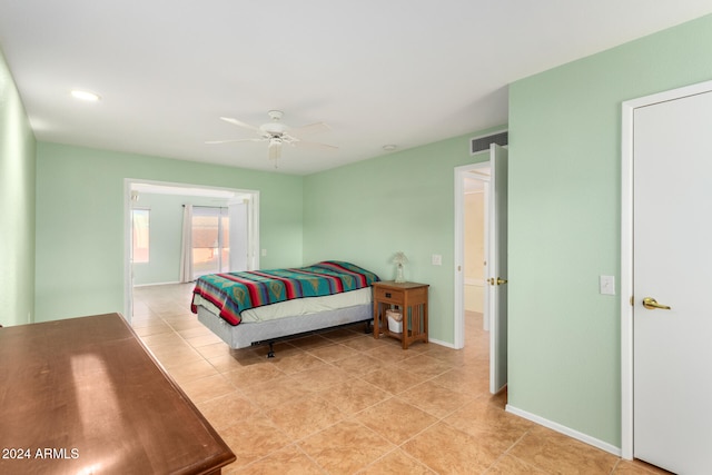 bedroom featuring ceiling fan and light tile patterned floors