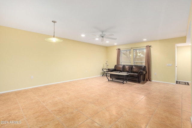 living room with light tile patterned floors and ceiling fan