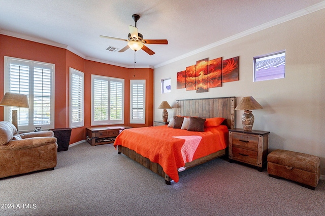 bedroom with ornamental molding, carpet flooring, visible vents, and a ceiling fan