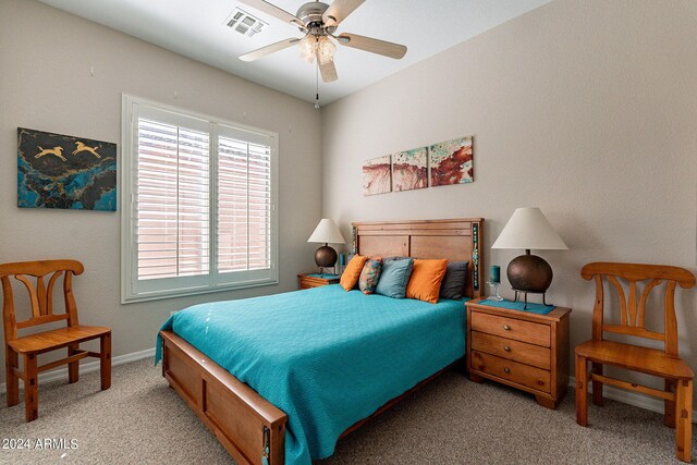 bedroom featuring carpet floors, baseboards, ceiling fan, and visible vents