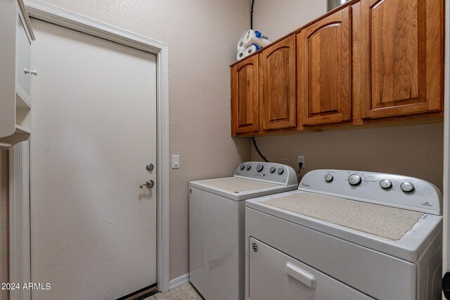 laundry room with cabinet space and independent washer and dryer