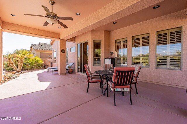 view of patio / terrace with a ceiling fan and outdoor dining space