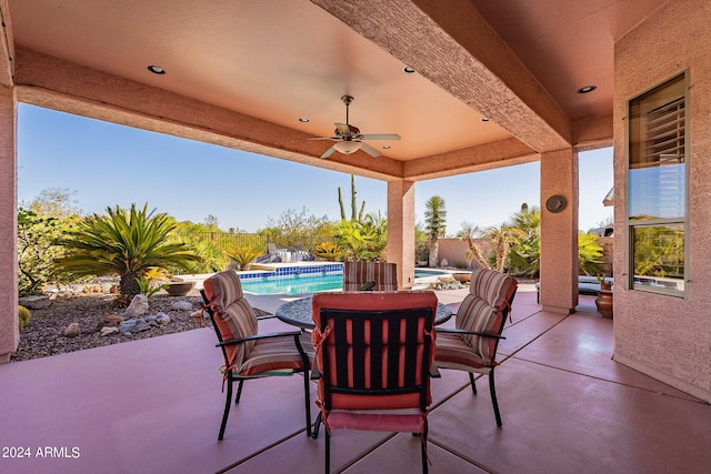 view of patio / terrace with ceiling fan, a fenced backyard, and an outdoor pool