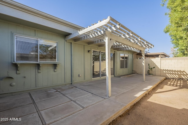 view of patio / terrace featuring fence and a pergola