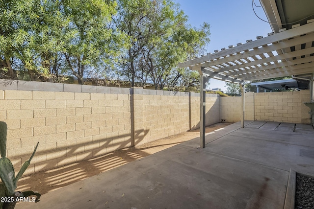 view of patio / terrace featuring a fenced backyard and a pergola