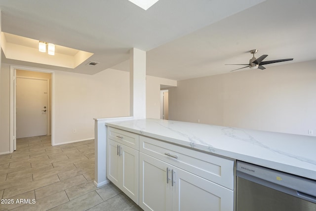 kitchen with light stone counters, visible vents, stainless steel dishwasher, white cabinetry, and ceiling fan