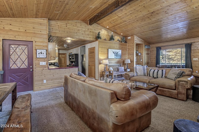 carpeted living room featuring wood walls, vaulted ceiling with beams, and wood ceiling