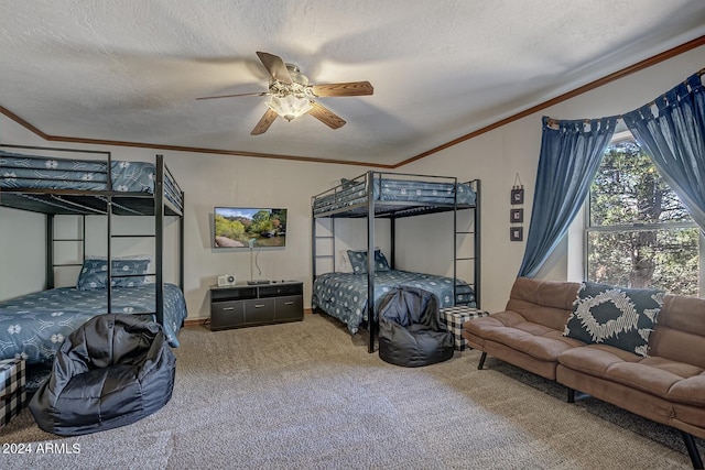 bedroom featuring ceiling fan, a textured ceiling, and carpet flooring