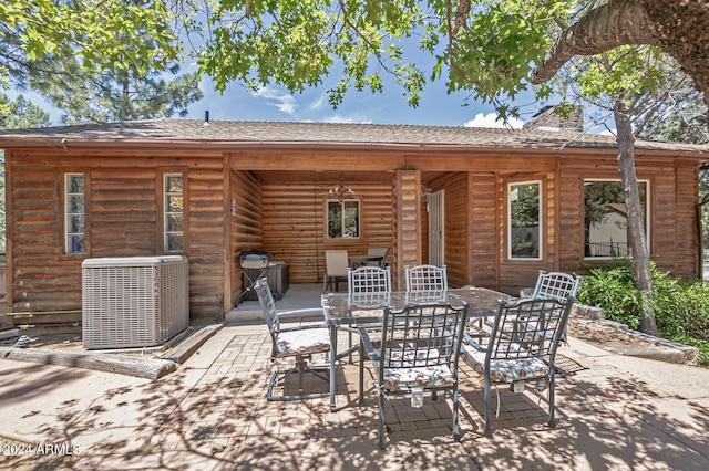 back of house with central AC and a patio area