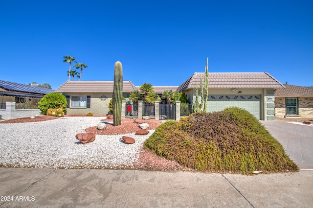 ranch-style home featuring a garage