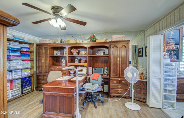 home office featuring light hardwood / wood-style floors and ceiling fan