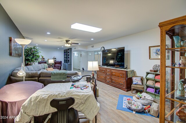 bedroom featuring ceiling fan and light hardwood / wood-style flooring