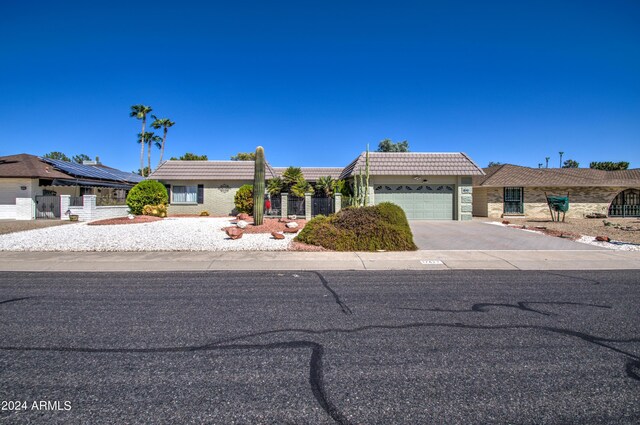 ranch-style house featuring a garage