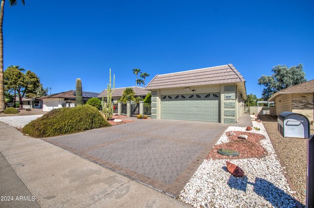 ranch-style home with a garage