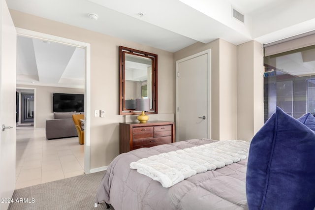 tiled bedroom featuring a closet