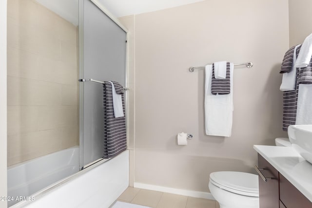 full bathroom featuring tile patterned flooring, vanity, toilet, and enclosed tub / shower combo